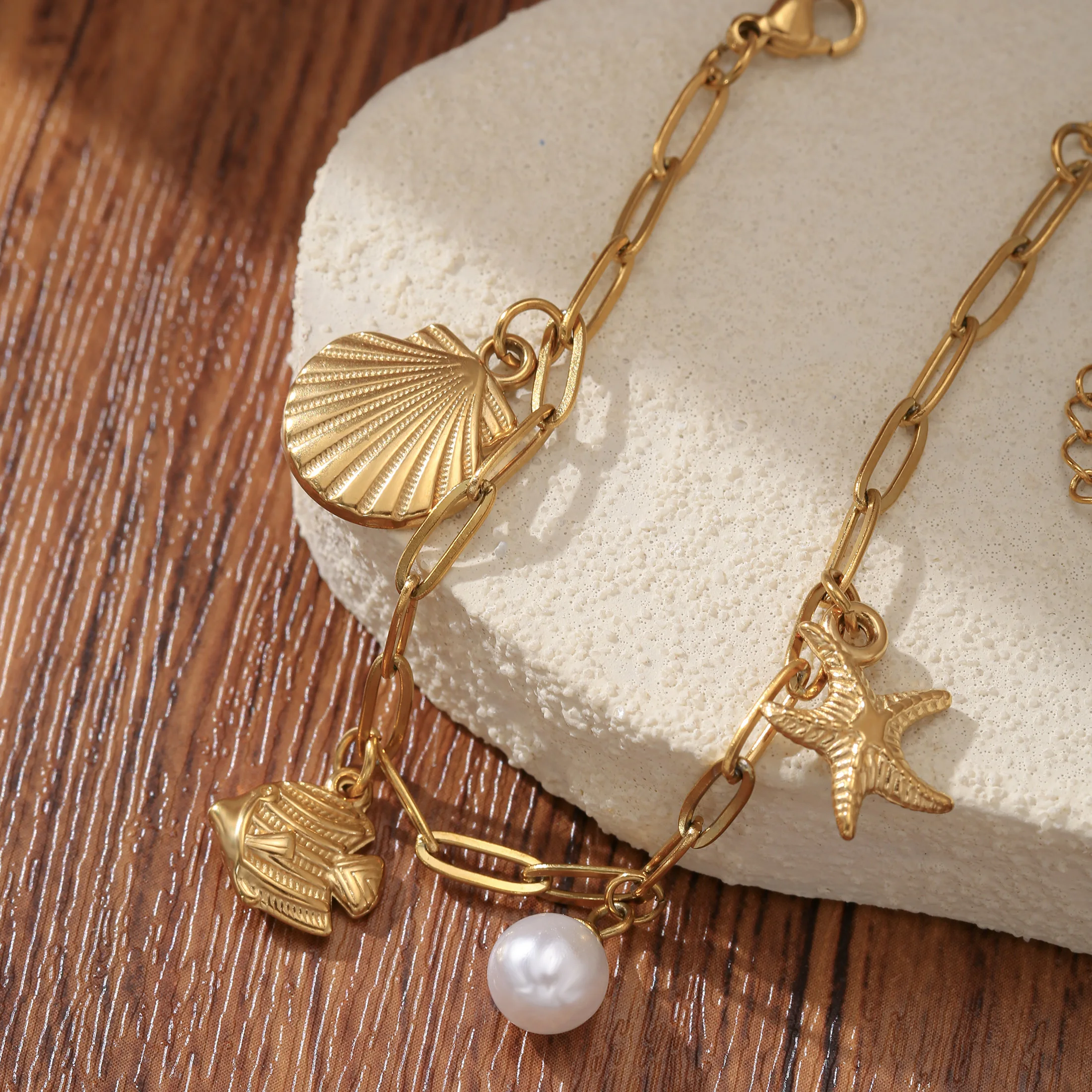 

Golden Tone Stainless Steel Ocean Charm Bracelet with Shell and Starfish Pendants for Women