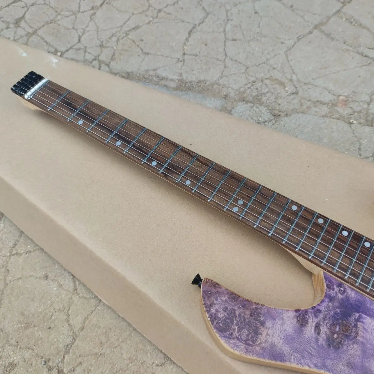 Special shape electric guitar, ash xylophone body, stainless steel wire. Burl veneer, body ash