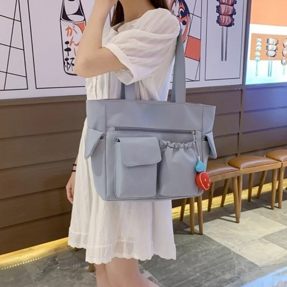 

Nylon Canvas Tote Bag Solid Color with Strawberry Pendant Student School Bag Handbag Korean Style Japanese Shoulder Bag