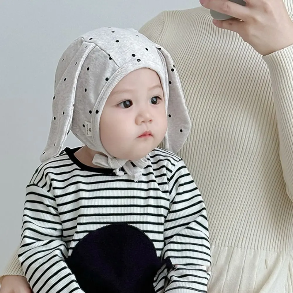 Gorro Fetal para bebé Ins, gorro con orejas de conejo para recién nacido con lunares de dibujos animados, gorro con correa para corbata, gorro infantil dulce para niños y niñas