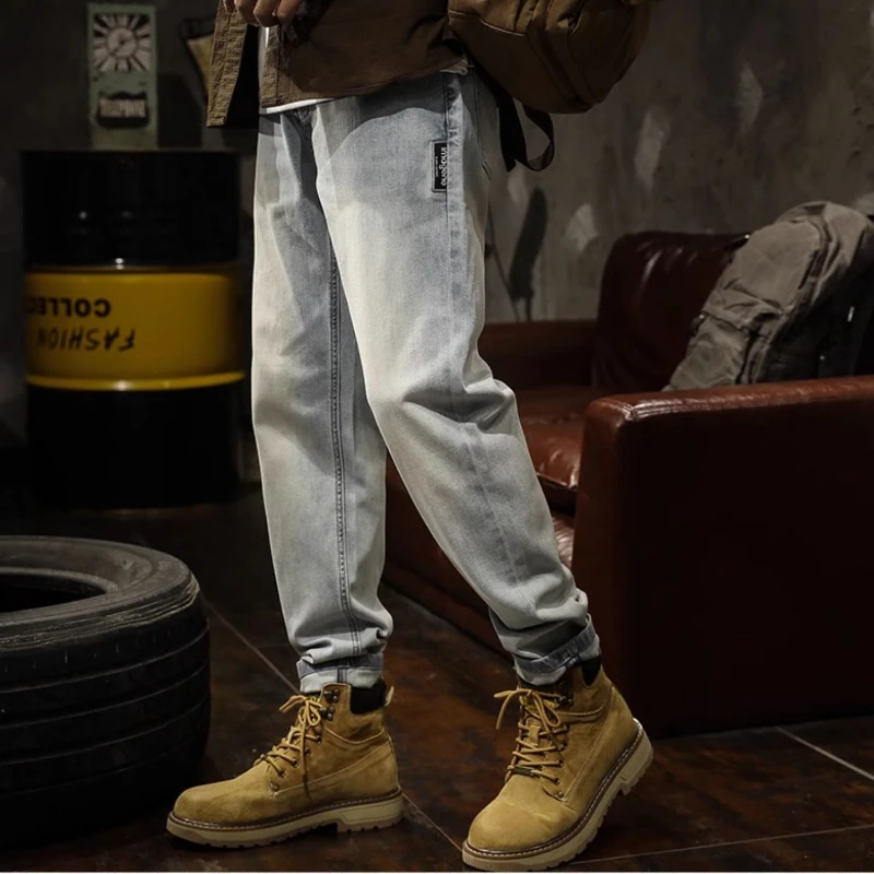 

Europe and the United States high street pants men's slim jeans new fashion brand washed light blue micro-cone foot pants