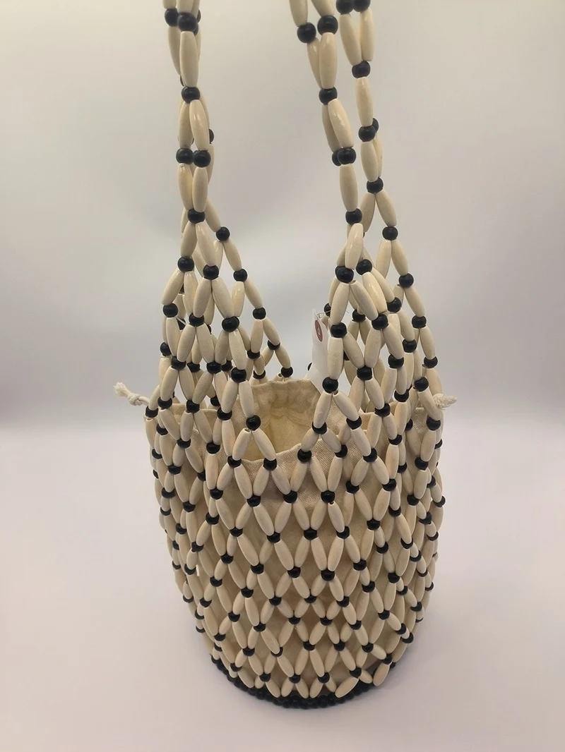 

Hand-woven Bags Women European American Niche Design Hollow Wooden Bead Portable Bucket Shoulder Bag Net Pocket