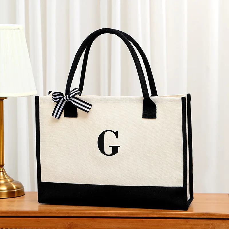 

Simple canvas handbag travel bag open-top black and white color-block tote bag with a bow handbag shopping bag