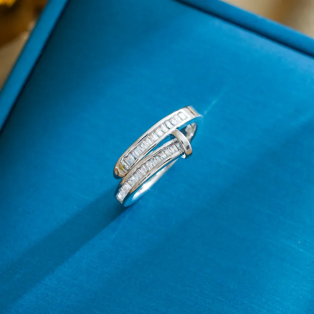 This is a latest unique, light luxury and niche design of a women's zircon ring with an open ring and a cool style.