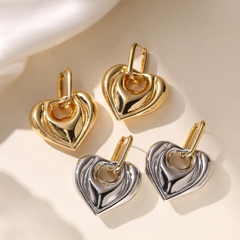

Женские серьги в европейском и американском металлическом стиле с медным покрытием из 18-каратного золота в форме сердца, нишевые серьги с преувеличенной индивидуальностью, новые