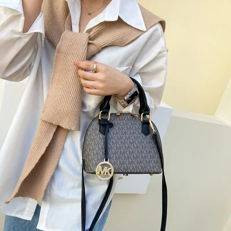 

2025 Новинка! Женская сумка через плечо в форме ракушки — высококачественный материал, большая вместимость, текстурированный дизайн с буквами, элегантная изогнутая форма