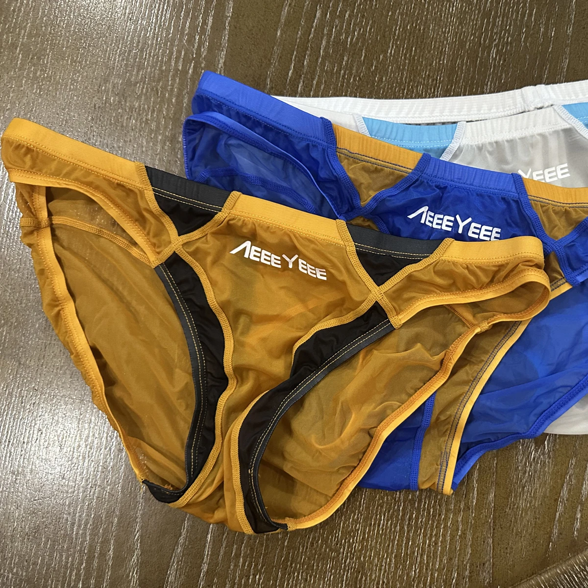 Men Sexy Fully Transparent Ultrathin Low Rise Underwear Breathable Quickdry Smooth Triangular Briefs See Through Swimming Trnks