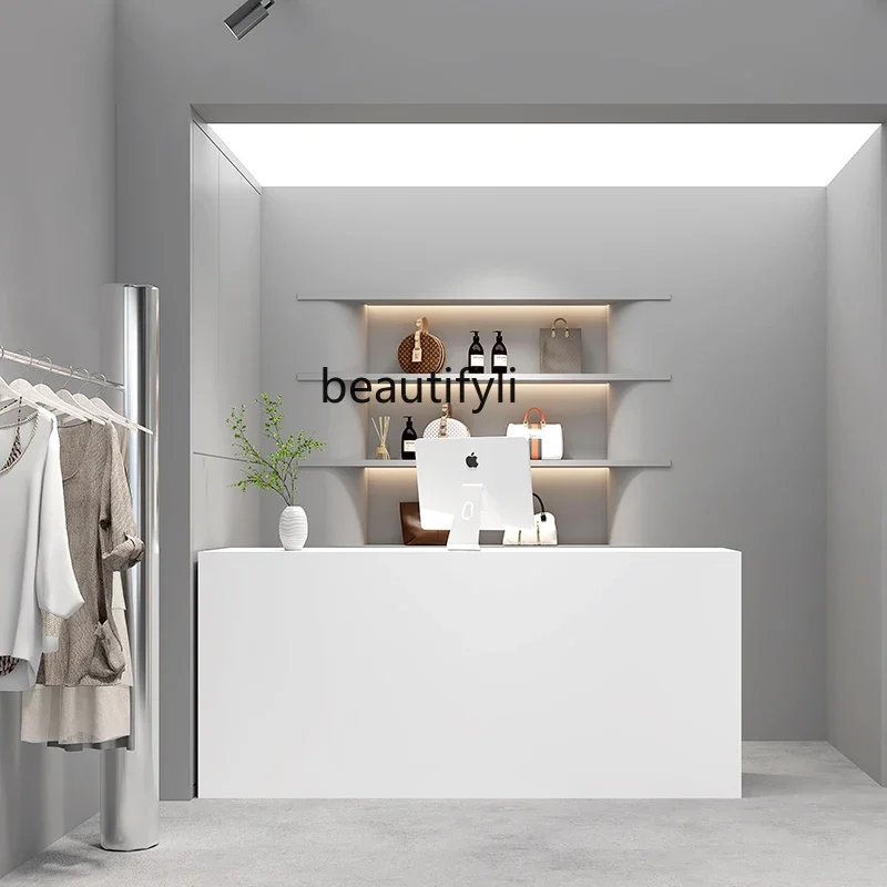 Clothing store checkout page store small counter black minimalist nail salon bar simple modern beauty salon front desk