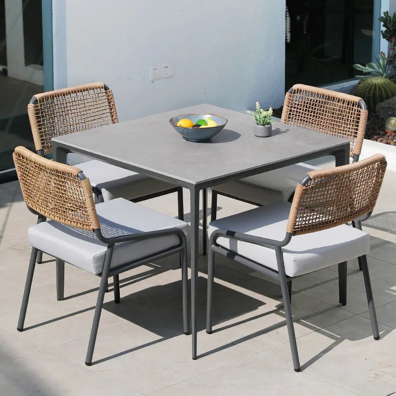 

Garden rock slab dining table and chairs Outdoor courtyard rattan chairs Rattan chairs Homestay hotel
