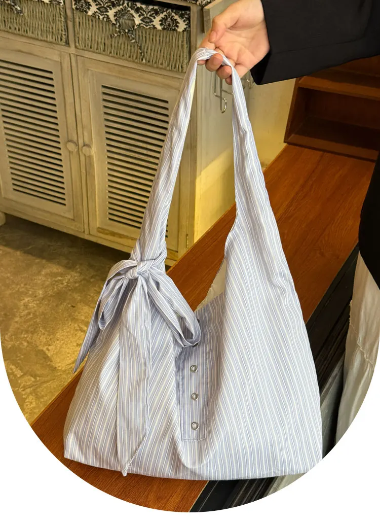 

Korean Striped Canvas Bag Women's 2025 New Large Capacity Bow Single Shoulder Niche Underarm Tote Bags