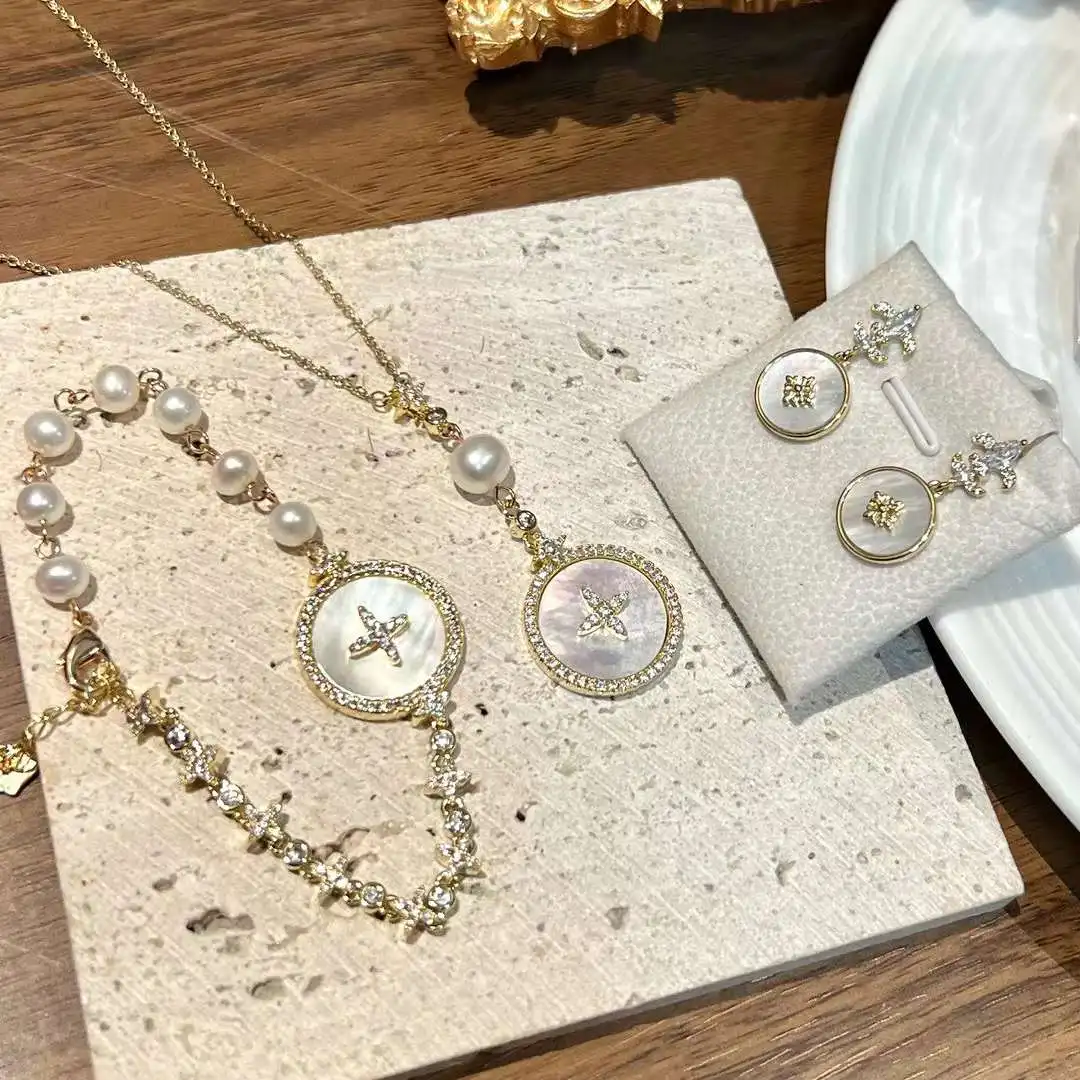 

Natural Seawater Shell Inlaid Big Brand Shell Three Piece Set of Natural Freshwater Pearl Necklace Bracelet Earrings Set