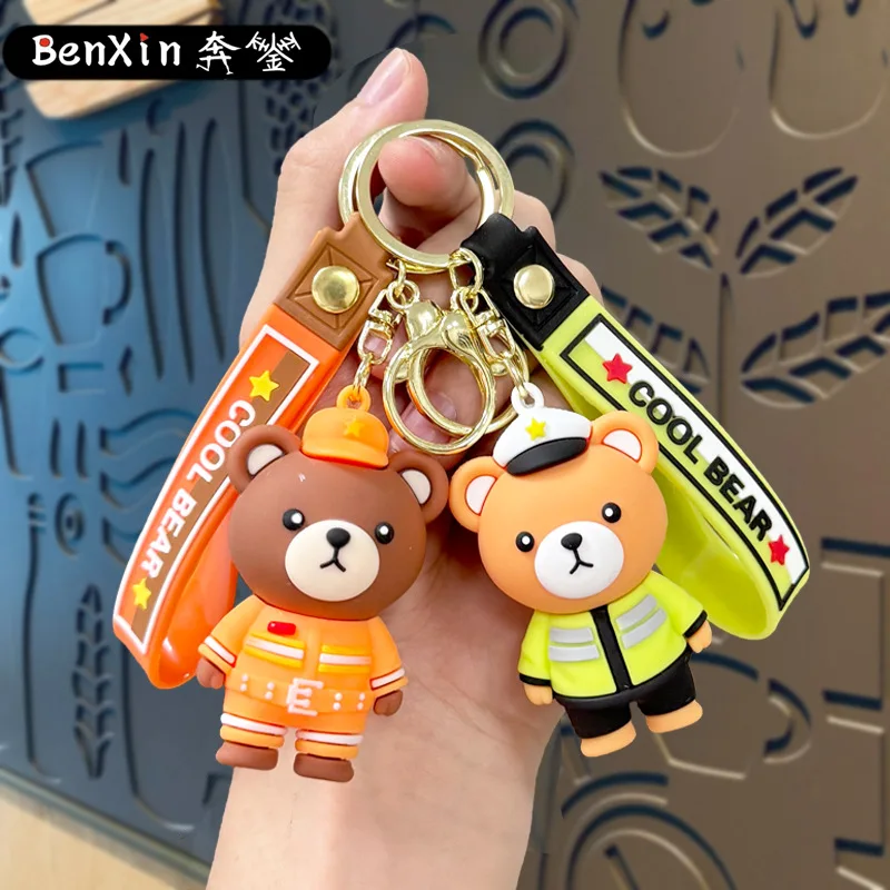 Minso Cartoon-Polizeibär-Schlüsselanhänger, Feuerwehrmann-Bärentaschen, Autoanhänger, Krallenmaschinen, kleine Geschenke für den Straßenstand