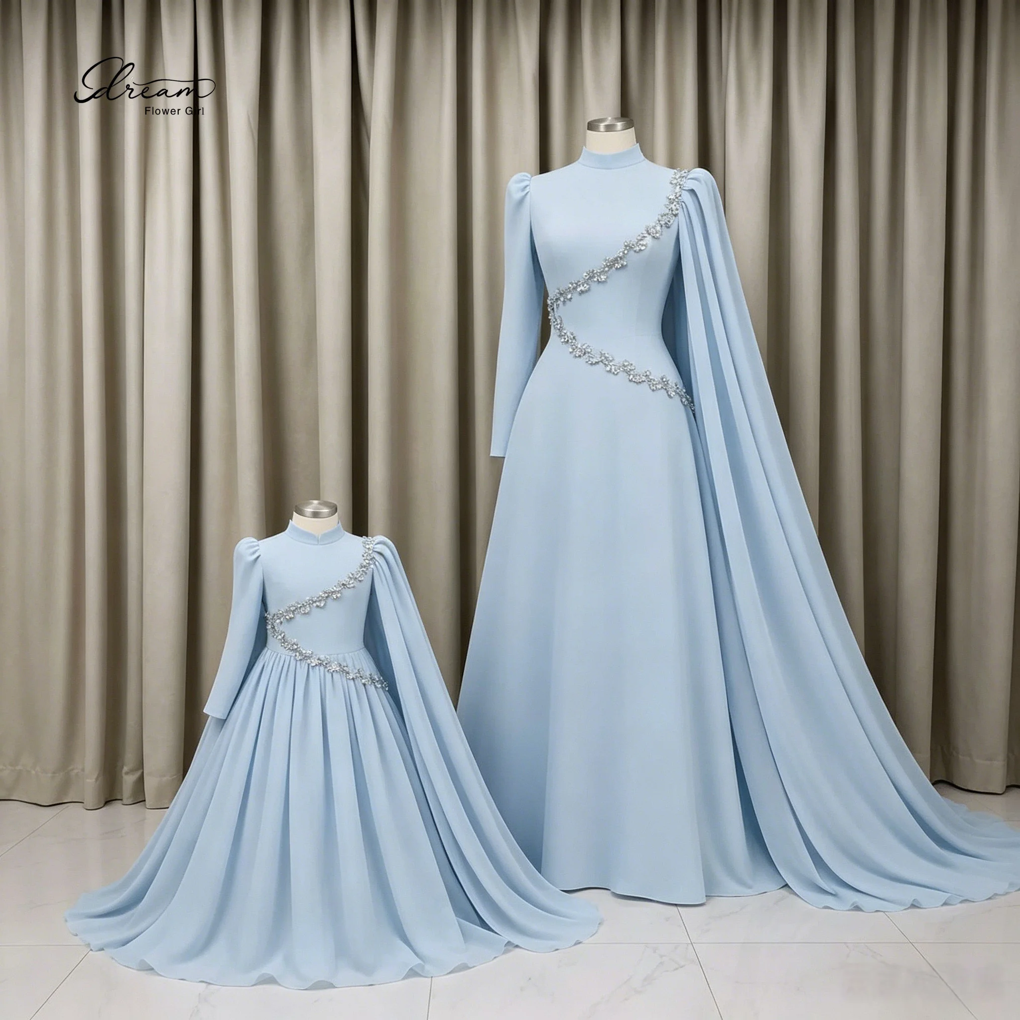 

Formal blue shawl-style long-sleeved floor-length evening gown with delicate petal beading design.