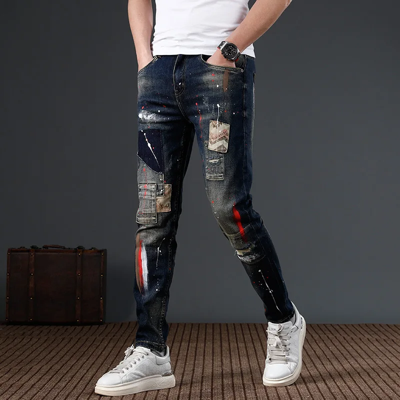 2024 New Fashion Patch Jeans moto per uomo con fori rotti vernice a inchiostro impiombata Slim Fit piedi piccoli moto padella stretta