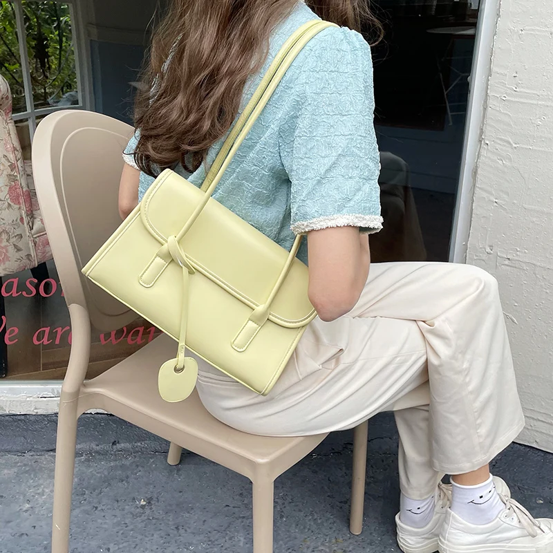 Yellow Shoulder Underarm Bag Women 2024 Spring/Summer New Fashionable French Texture PU Shoulder Bag Elegant pendants Handbag