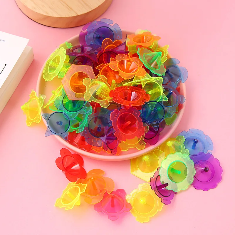 100pcs Mini colorato trasparente giroscopio fiore stella rotante giroscopio giocattoli bambini festa di compleanno bomboniere trattare regali per