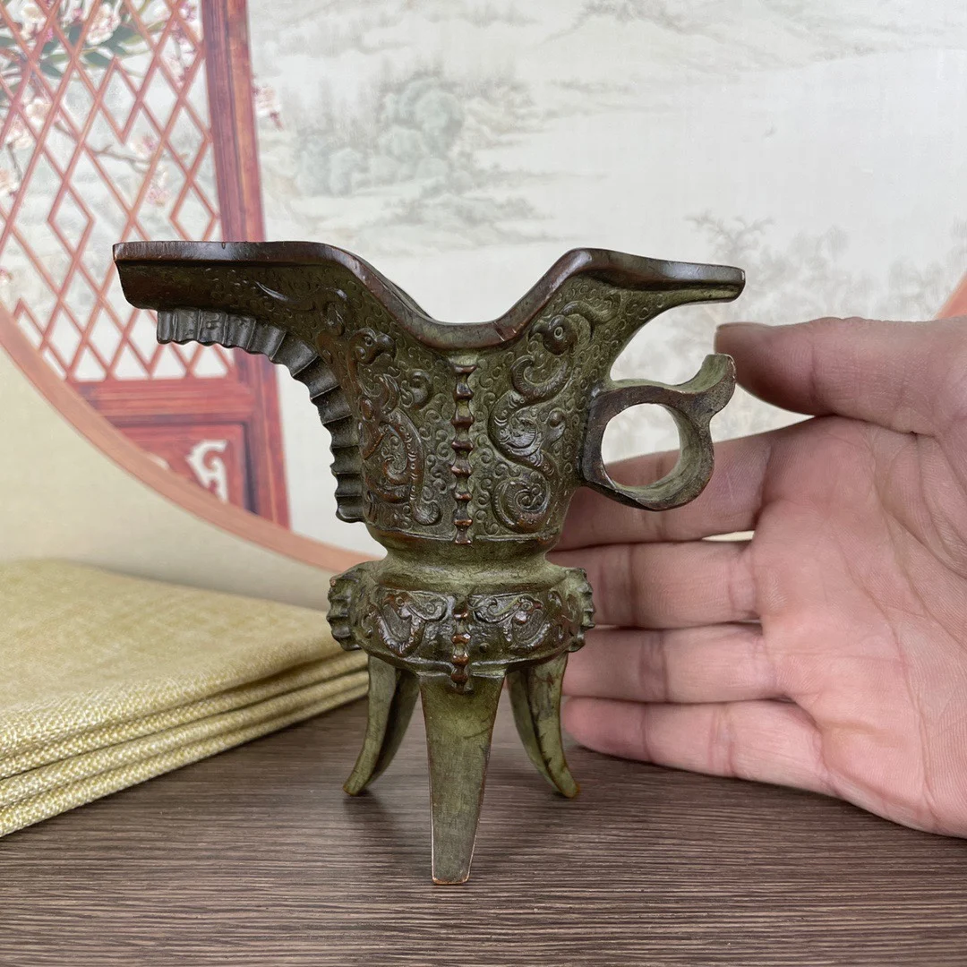 

Bronze wine bottles, ancient wine glasses, three-legged vermilion bird pattern cups, film and television props, home decoration