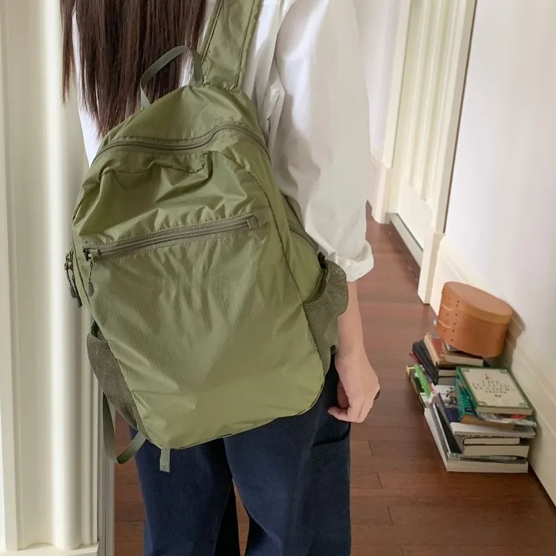 2026 autumn fashion simple 15L nylon lightweight backpack for men and women commuting waterproof travel school backpack