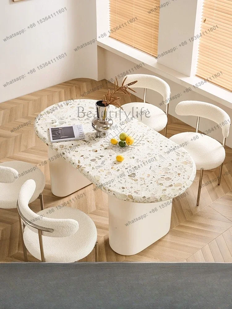 

56French cream feng shui grinding stone dining table and chair combination household oval light luxury marble dining table
