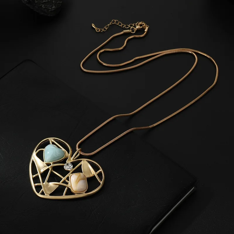

Kaseakia Colorful Hollow Metal Heart Pendant Sweater Chain Long Necklace for Women