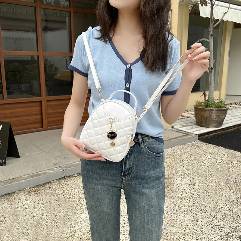 2023 New Fashionable and Magnificent Lingge Embroidered Cat Head Pendant Backpack Personalized Small One Shoulder Crossbody Bag