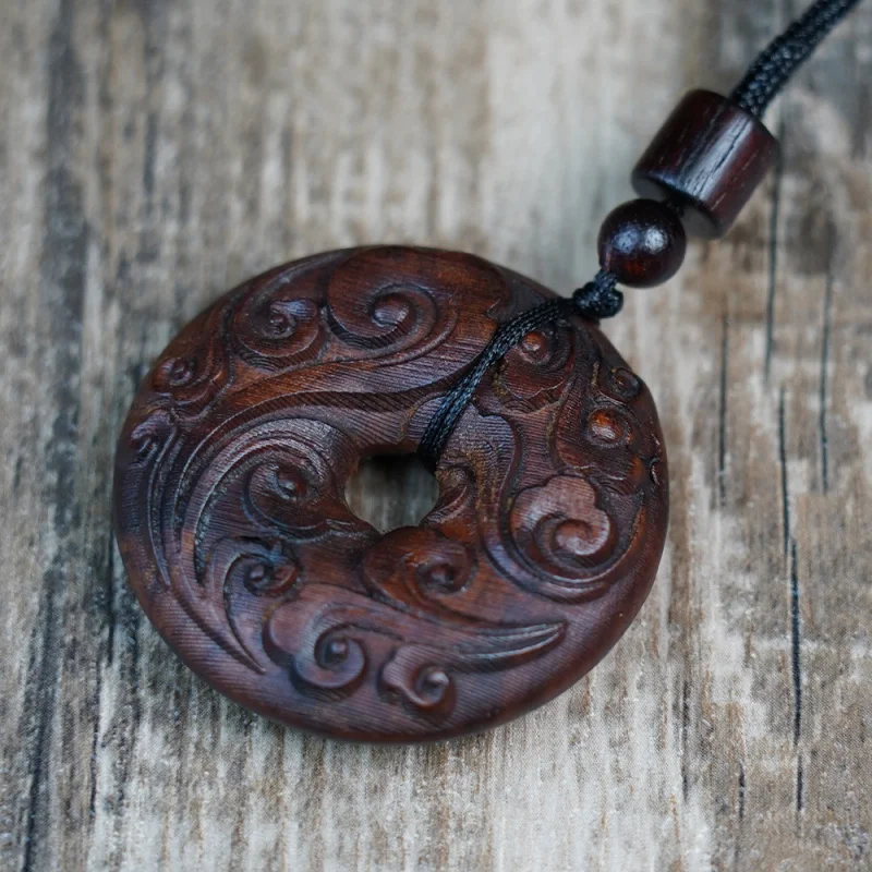 

Natural lightning-struck jujube wood auspicious cloud peace pendant, hand-carved wooden ornament