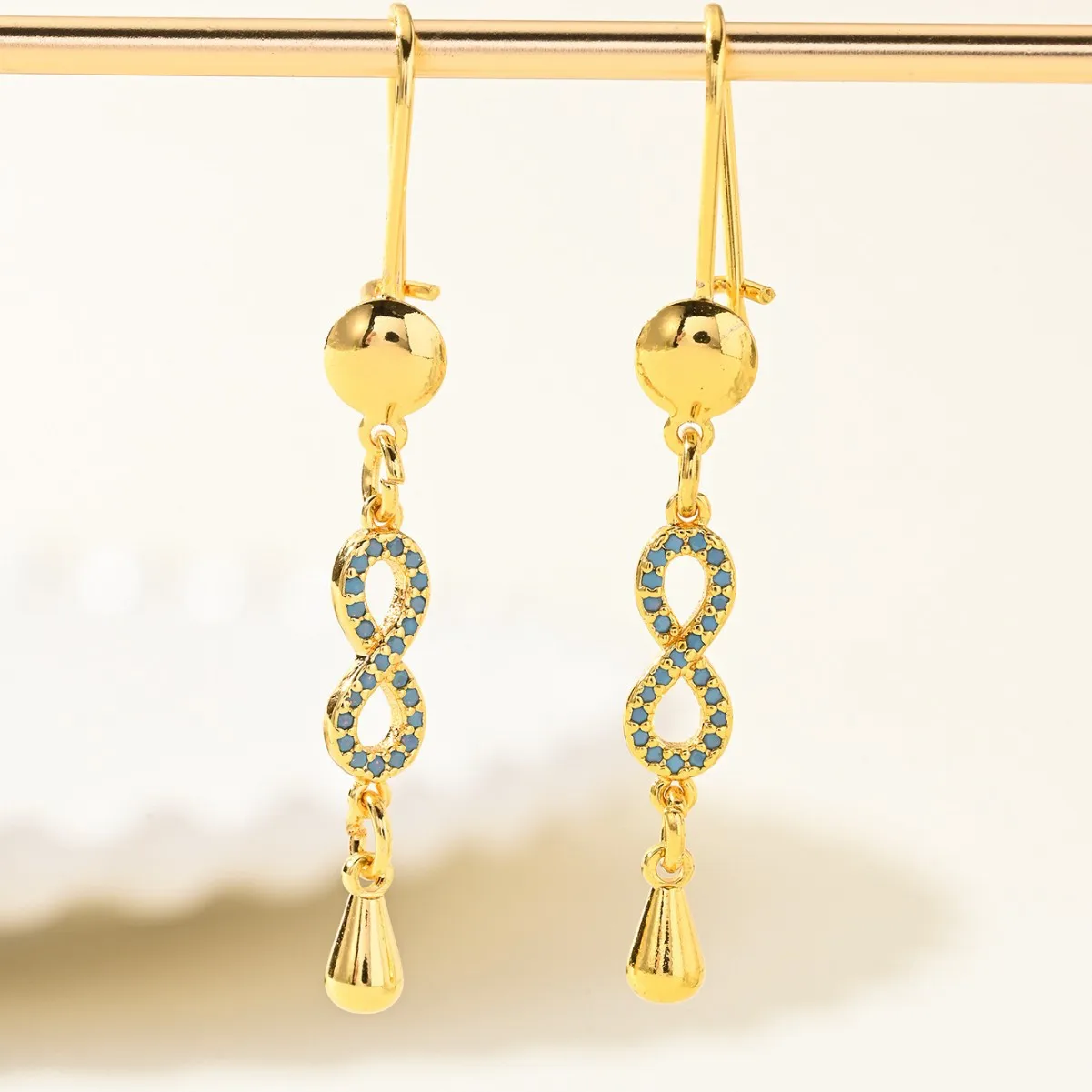 9999 gold European infinity symbol earrings with micro-set colored zirconia, fashionable and high-end ear accessories