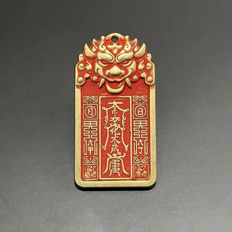 Antique cinnabar copper pendant featuring a tiger head general, Taoist talisman, and double brass dragon charm for personal wear