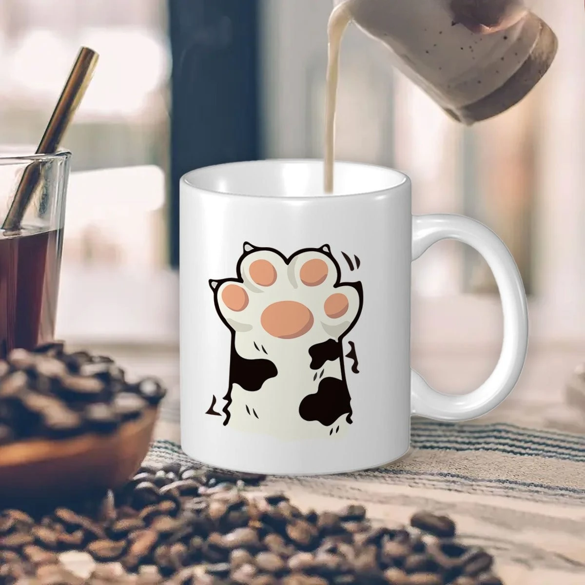 This ceramic mug features paw prints and cat paw designs, making it perfect for everyday use.