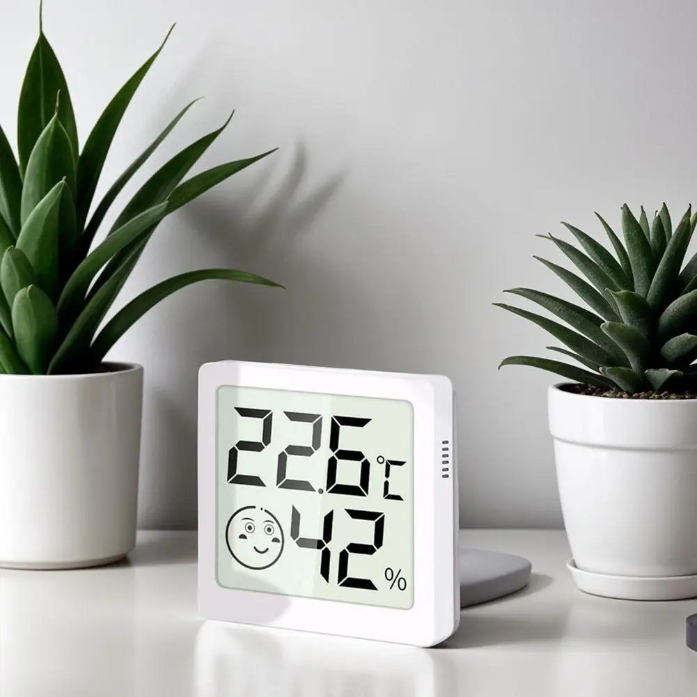 Mini Smile محطة الطقس الداخلية والخارجية LCD الإلكترونية الرقمية مقياس رطوبة الهواء ودرجة الحرارة المنزل الذكي