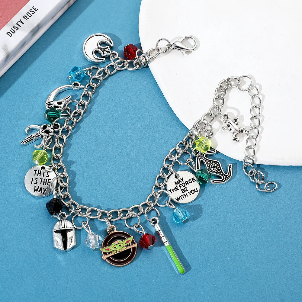 Star Wars Fan Jewelry the Mandalorian Inspired Charm Bracelet with Grogu Mythosaur Skull And Lightsaber Details Sci-Fi Accessory - view 2