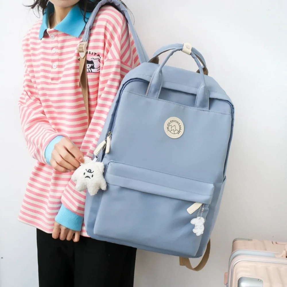 Zaino da donna leggero e impermeabile Borsa da scuola in nylon di grande capacità Zaino da viaggio ergonomico in tinta unita per adolescenti