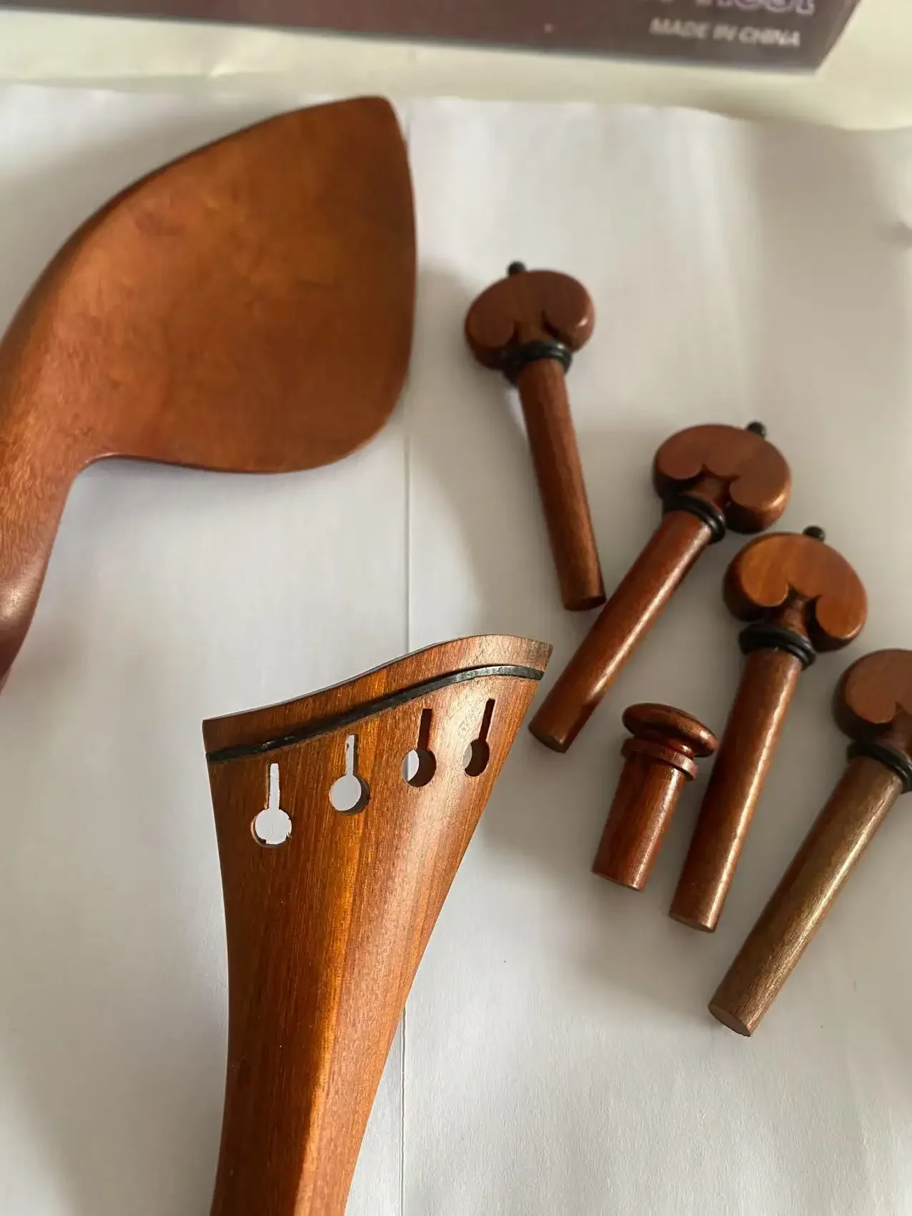 

VIOLIN FITTINGS 4/4, PERNAMBUCO, PEGS, HARP TAILPIECE, CHIN REST, END PIN one set