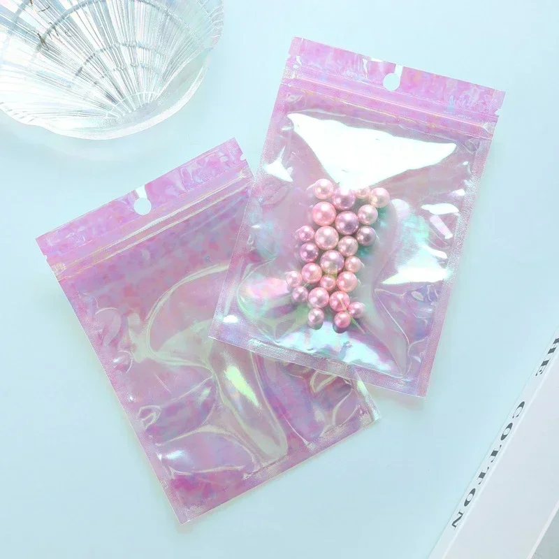 

Zipper Packaging Bubble Bag 100pcs Pink Stand Up Holographic Flat Pouches Small Laser Zip Lock Plastic Bags for Cosmetic Jewelry