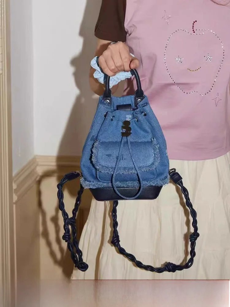 

Tagi Painter Double Shoulder Bag Handwoven Cowboy Drawstring Bucket Backpack Small Size Commuter Style Youth Backpack