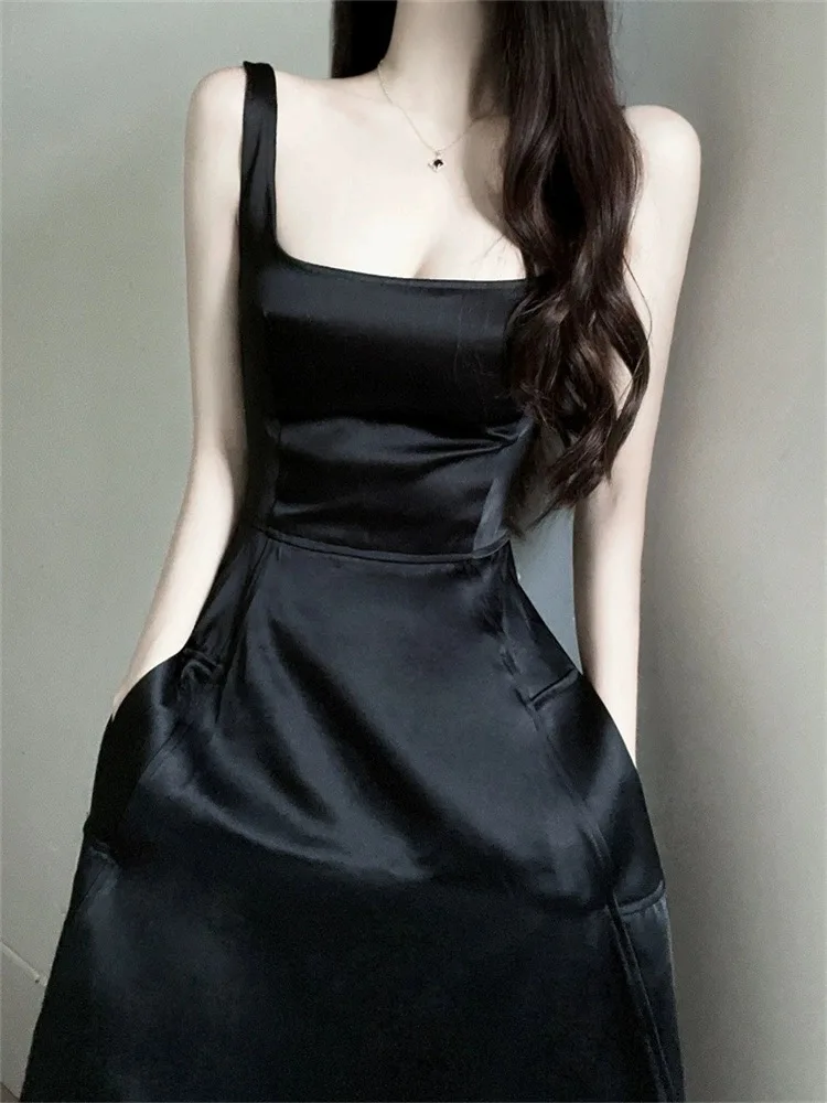 B-033 Falda larga 2025 Nuevo vestido de tirantes de estilo occidental con encanto exquisito estilo hermana de vacaciones junto al mar