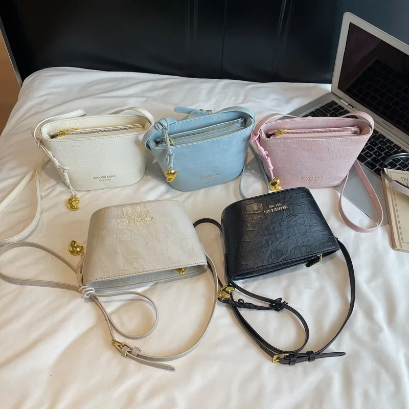 

Korean Minimalist Bucket | Stone Embossed Summer Tote | Elevated Top Handle Crossbody with Artisanal Braid & Dual-Space Design​