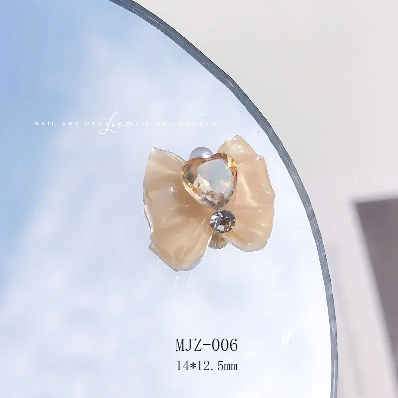 10 pçs 3d arco nó cristal coração diamante jóias prego broca marinheiro-beleza menina unhas encantos 14x12.5mm resina manicure acessórios