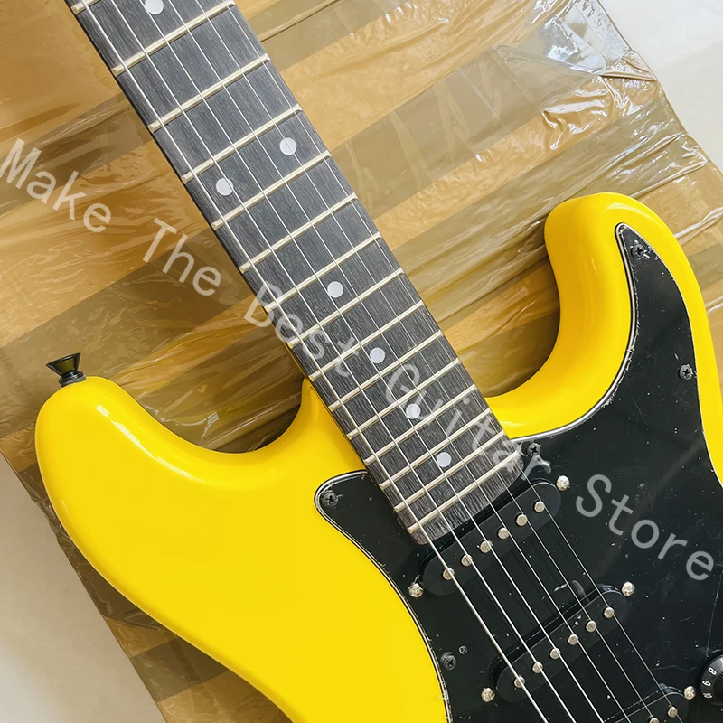 Classic electric guitar, tremolo bridge, pickup combination, fast shipping.