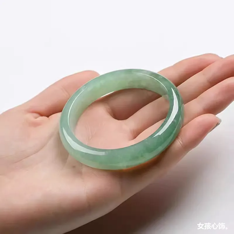 Jadeite bracelet, Myanmar ice-like texture, with a light green and pale green hue, white background, and a hint of green oil, su