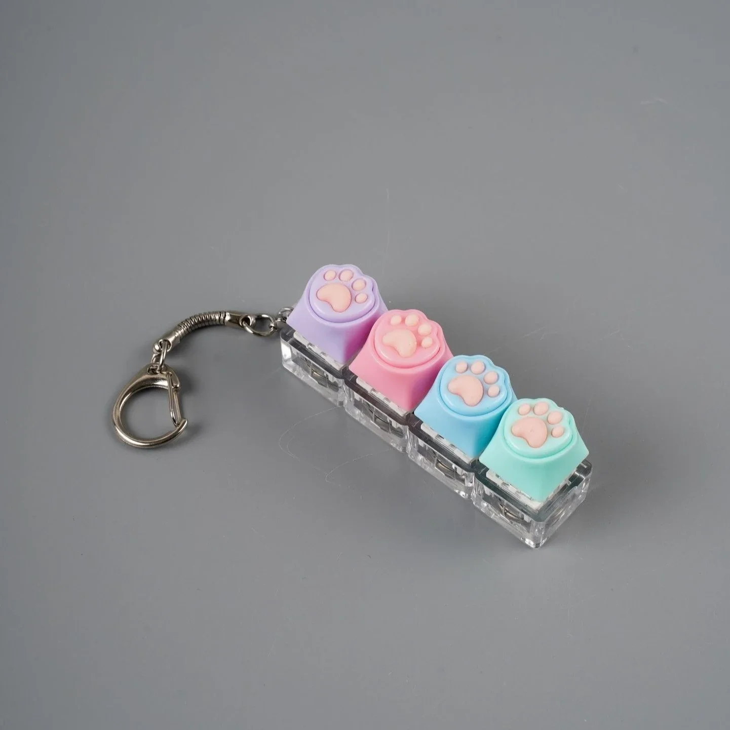 Luminous LED Fidget toy pressure relief button, used to relieve anxiety, silicone cat paw keyboard style clicker keychain