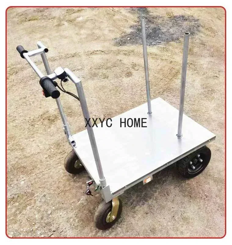 Carrello di carico elettrico Tirare il carico nell'ascensore Spinta a mano Carrello portatile con piattaforma di movimentazione a quattro ruote
