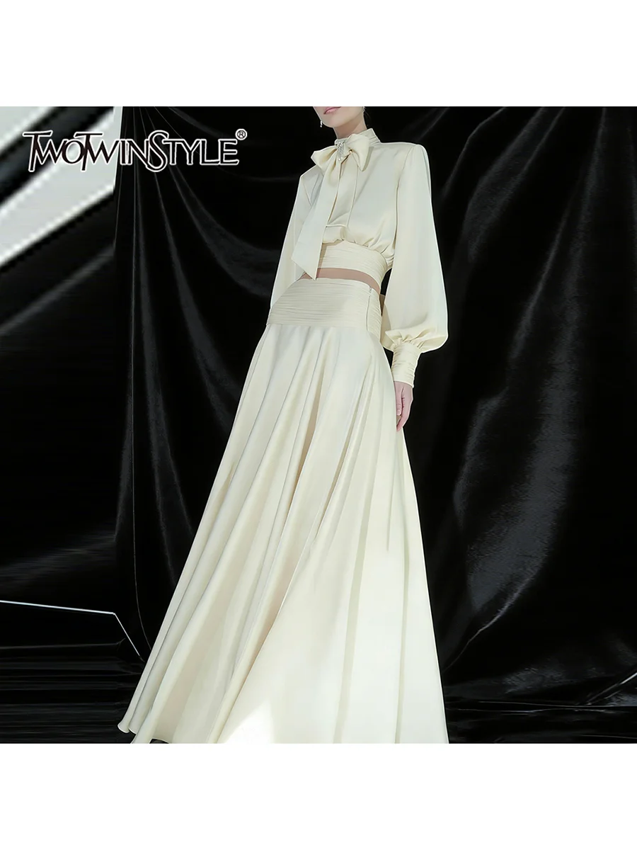 

TWOTWINSTYLE Elegant Spliced Fold Two Piece Sets for Women Stand Collar Long Sleeve Top High Waist A Line Solid Set Female 2026