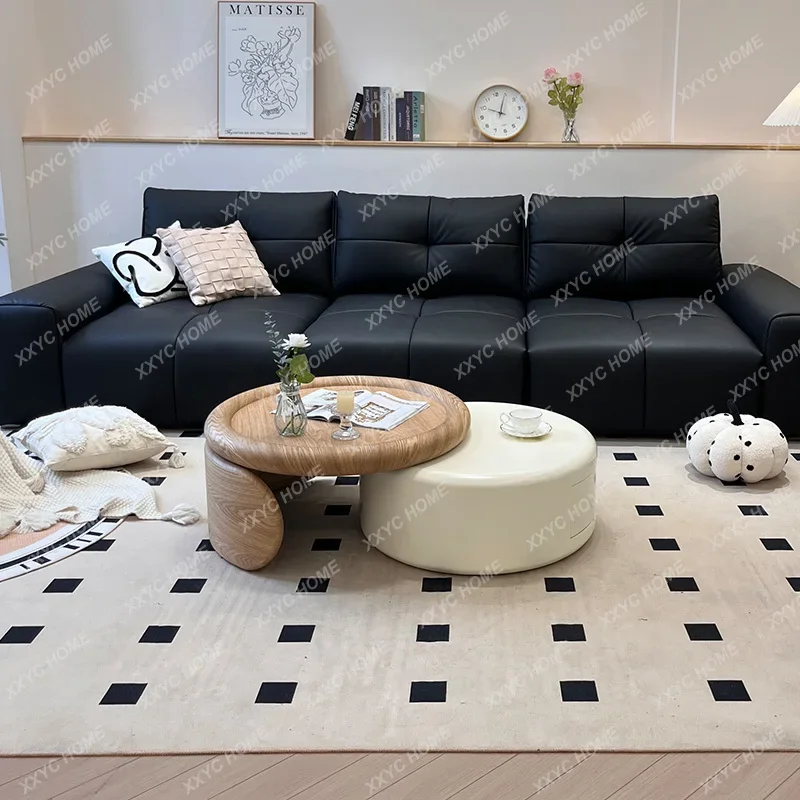 

A Cream wind retractable coffee table designer living room household size round combination high sense