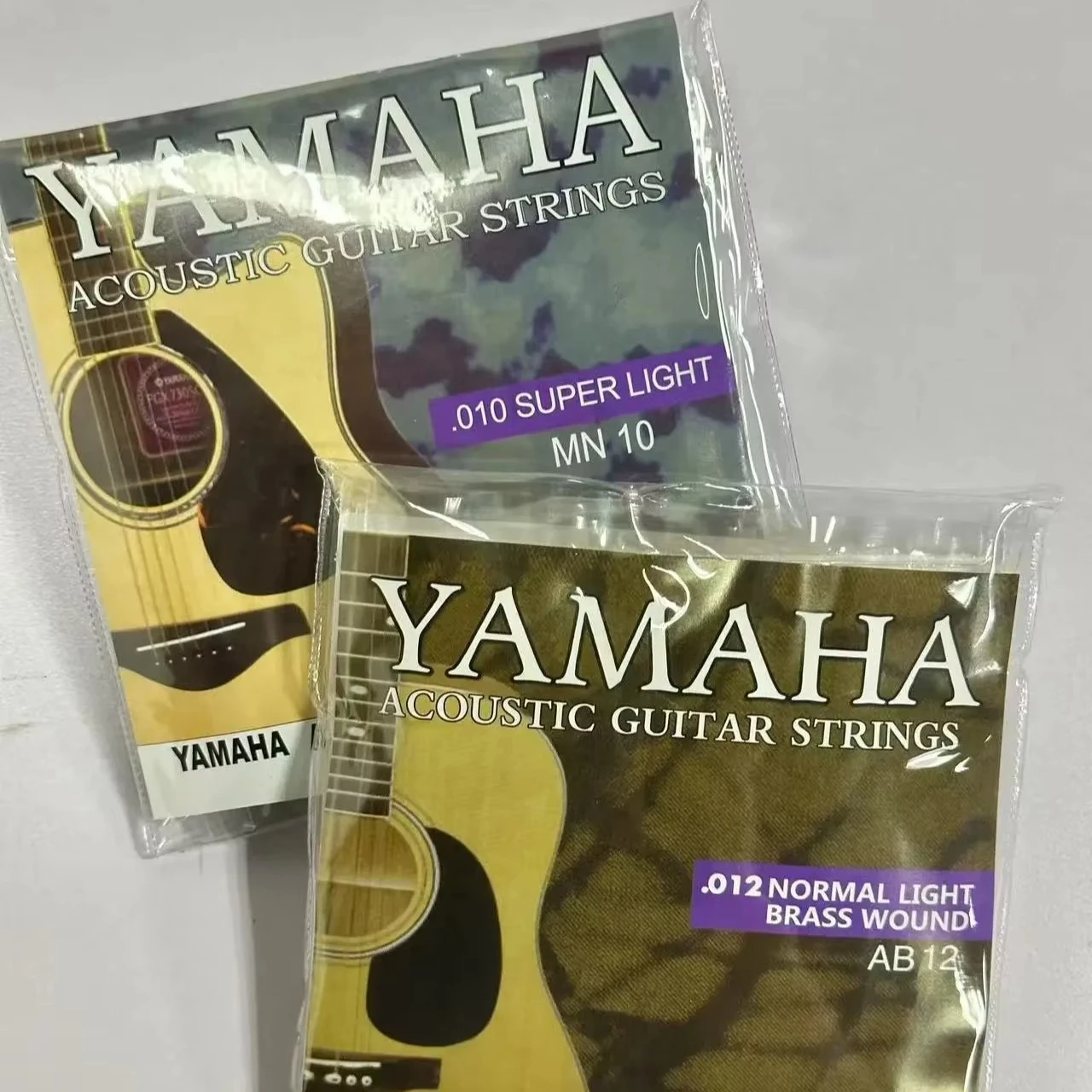 Cuerdas para Guitarra Acústica Yamaha, Entorchadas en Latón, AB12/MN10, Calibre Ligero 0.12-0.52 y Calibre Super Ligero 0.10-0.47, para Música Folk/Pop, Venta al Por Mayor