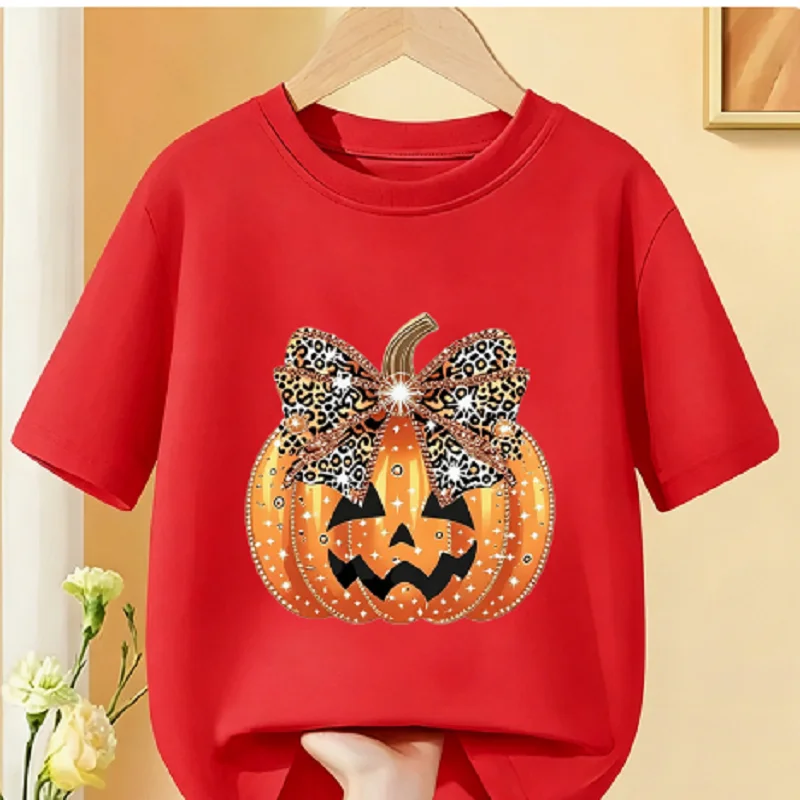 Cute Halloween-themed children's base layer T-shirt with playful pumpkin lantern and smiling face print