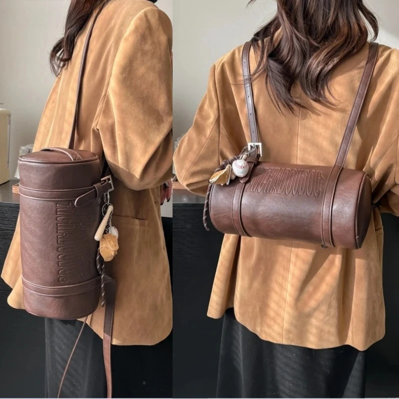 

2025 Winter Latest Designer Handbags Luxury Cross Body Bag with PendantMultifunctional Cylinder Shaped Shoulder Bags for Women