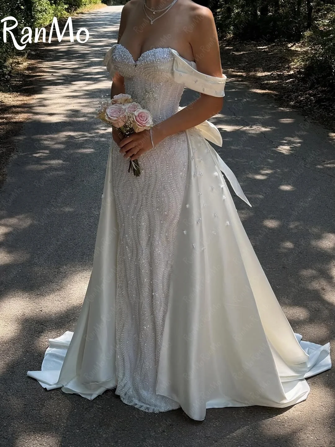 Ranmo جديد 2025 فستان زفاف فاخر على شكل قلب بدون أكتاف مطرز بفيونكة دانتيل Vestido de novia فستان زفاف لؤلؤي مشد مخصص