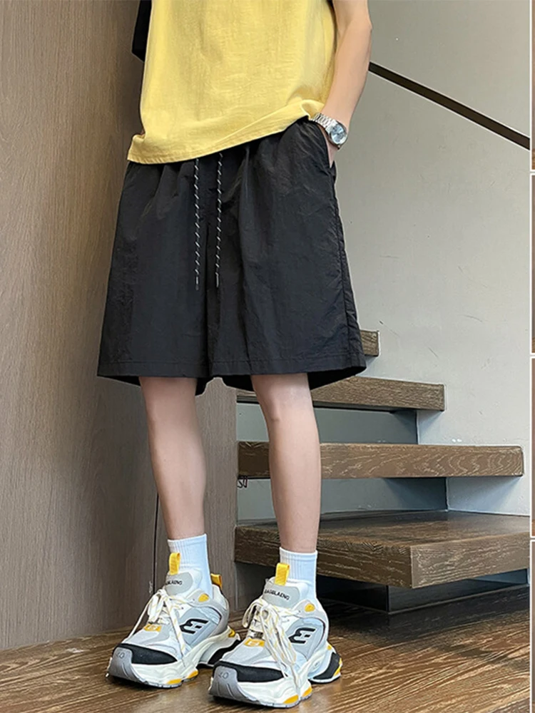 Pantaloncini sportivi da donna con lacci arancioni 2025 Nuovi pantaloni estivi ad asciugatura rapida Pantaloni casual larghi versatili alla moda a cinque quarti