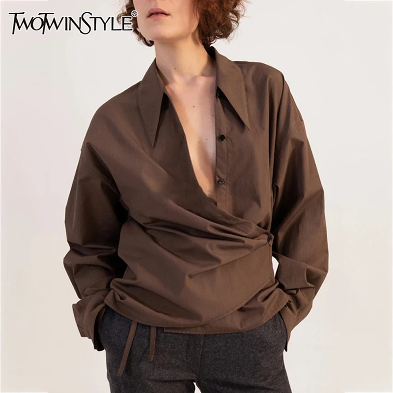 

TWOTWINSTYLE Solid Irregular Patchwork Folds Blouse For Women Lapel Long Sleeve Spliced Button Asymmetrical Shirts Female New